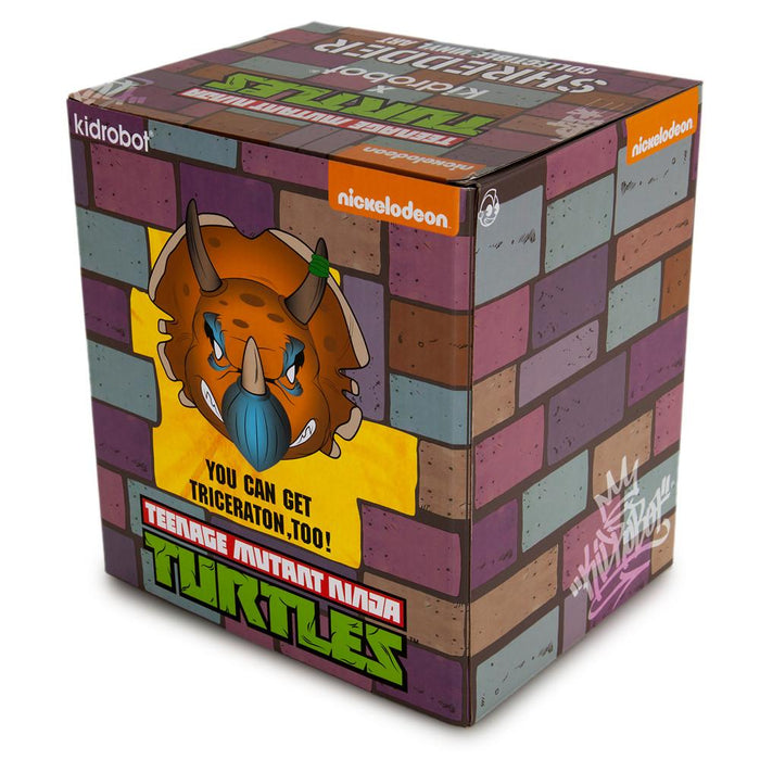 Teenage Mutant Ninja Turtles Triceraton 7-inch vinyl art figure by Kidrobot in orange edition, showing detailed sculpt and vibrant colors.
