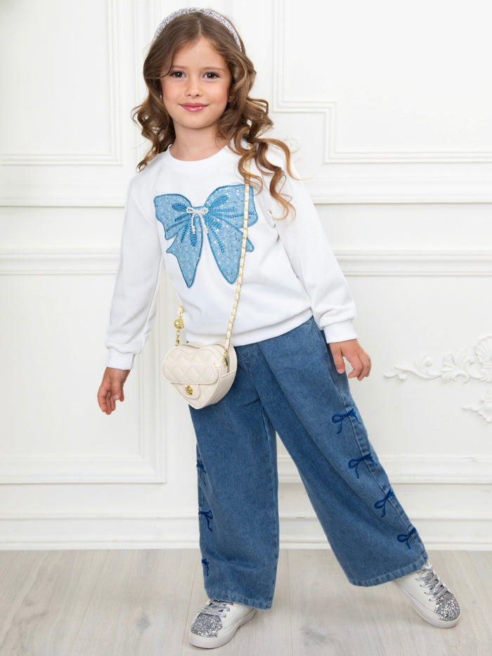 Cute girls matching set with bow sweatshirt and denim jeans