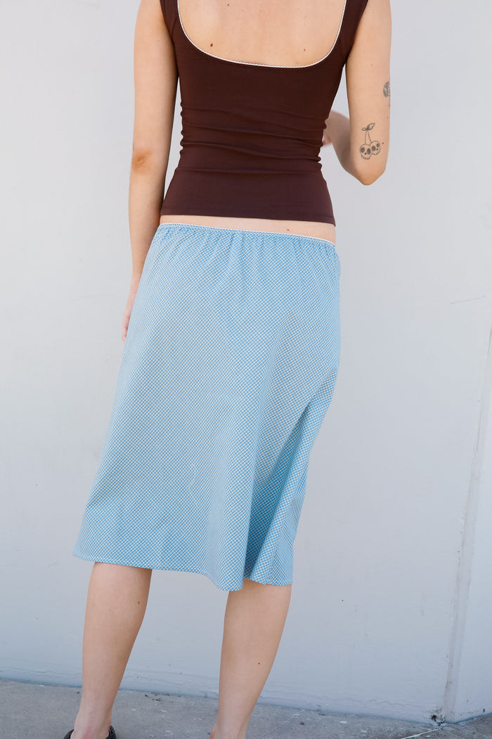 WOVEN BIAS MIDI SLIP SKIRT IN CAPRI