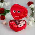 Yummy World Amore plush toy resembling a heart-shaped box of chocolates with interactive features, soft and colorful plush.