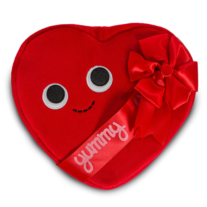 Yummy World Amore plush toy resembling a heart-shaped box of chocolates with interactive features, soft and colorful plush material.