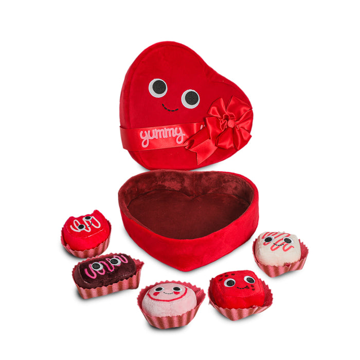 Yummy World Amore plush toy resembling a heart-shaped box of chocolates with interactive features, soft and colorful plush material.