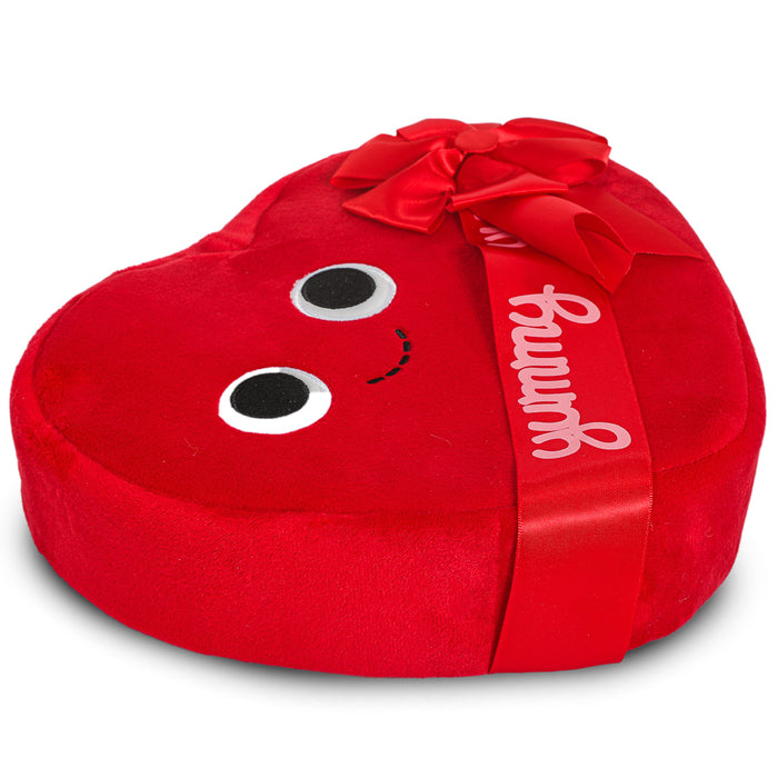 Yummy World Amore plush toy resembling a heart-shaped box of chocolates, soft and interactive, designed for cuddling and play.