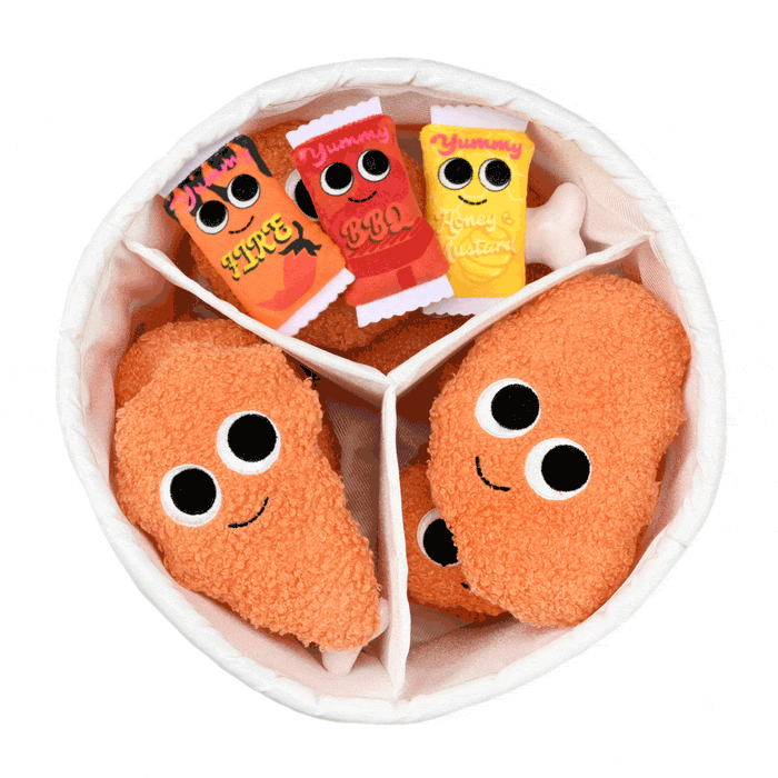 Yummy World Bertha plush toy in a fried chicken bucket, interactive soft plush character with detailed fried chicken design.