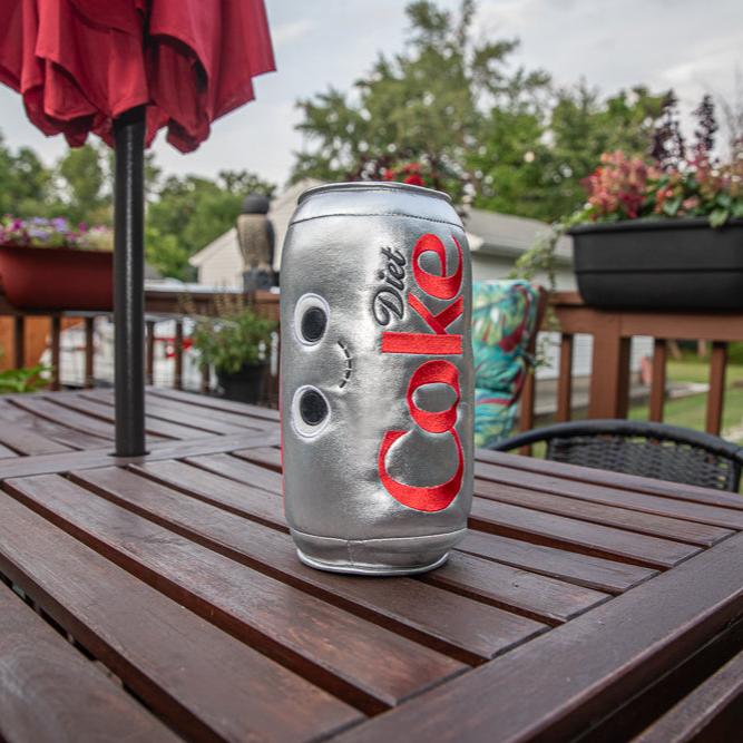 Coca-Cola Yummy World 10-inch plush can with sound, featuring colorful Diet Coke design and soft fabric for kids and collectors.