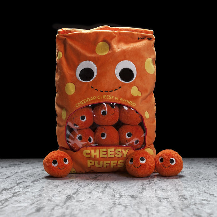 Yummy World XL Cheesy Puffs plush toy showing a colorful, soft cheese puff character with a smiling face and textured surface.